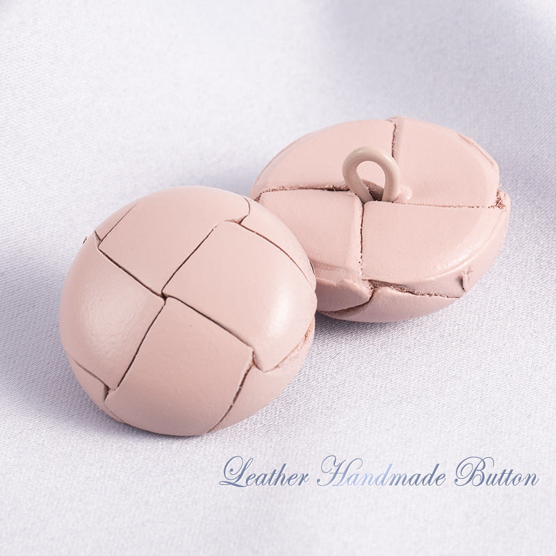 Light pink leather sweater buttons with stitched panels and loop shank (pair)