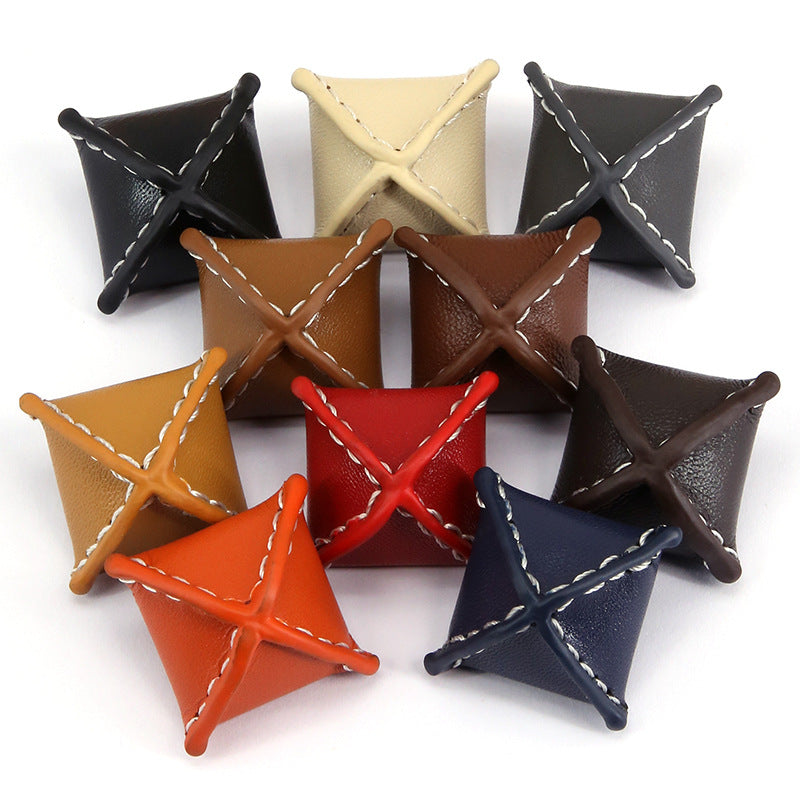 Set of 10 rhombus leather buttons with stitched X design, assorted colors