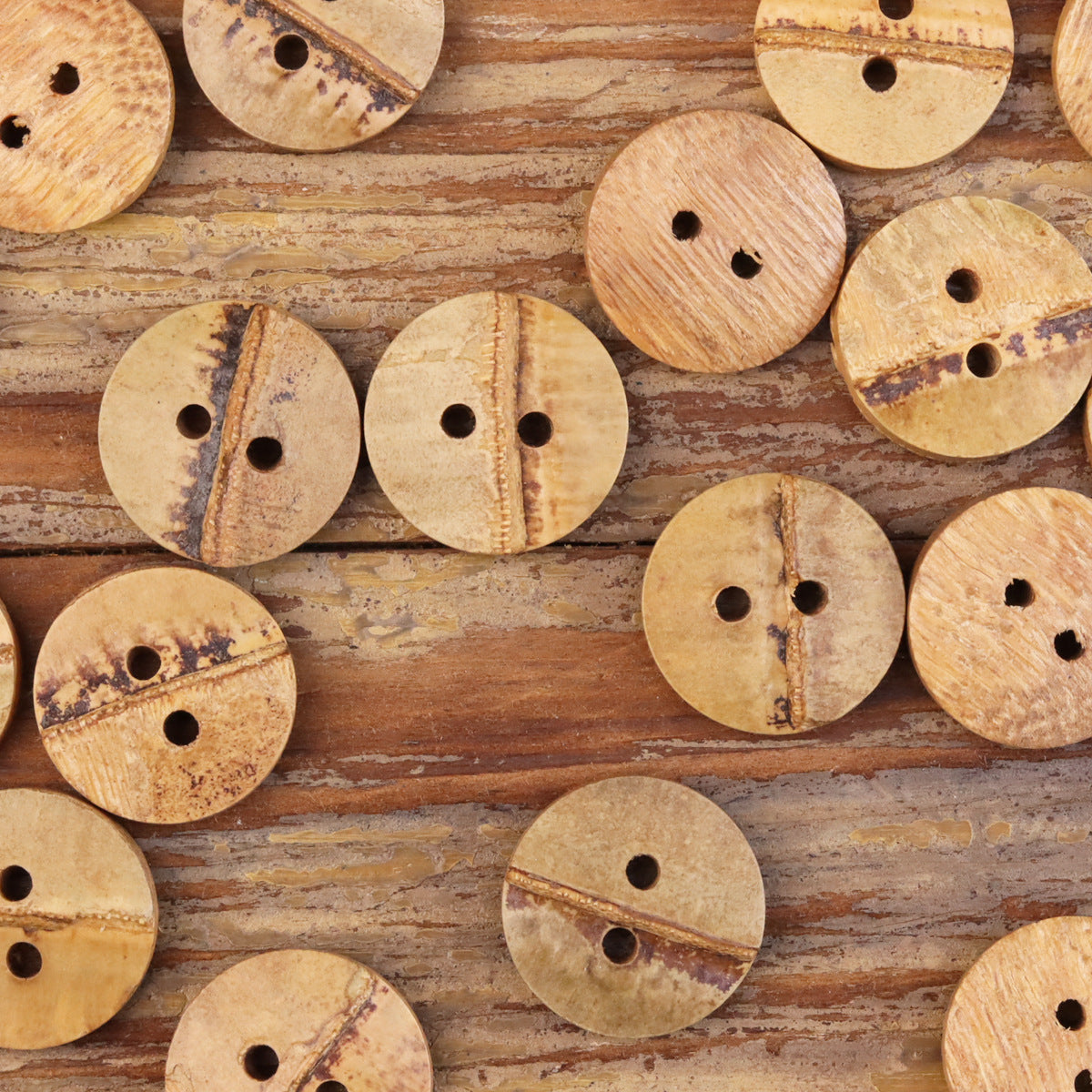 Assorted natural bamboo two-hole buttons, tan rounds with two holes each