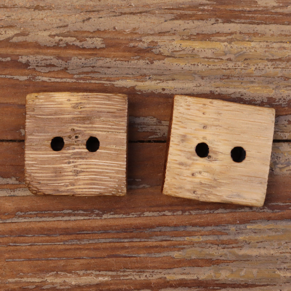 Square two-hole bamboo buttons, natural color, side-by-side close-up