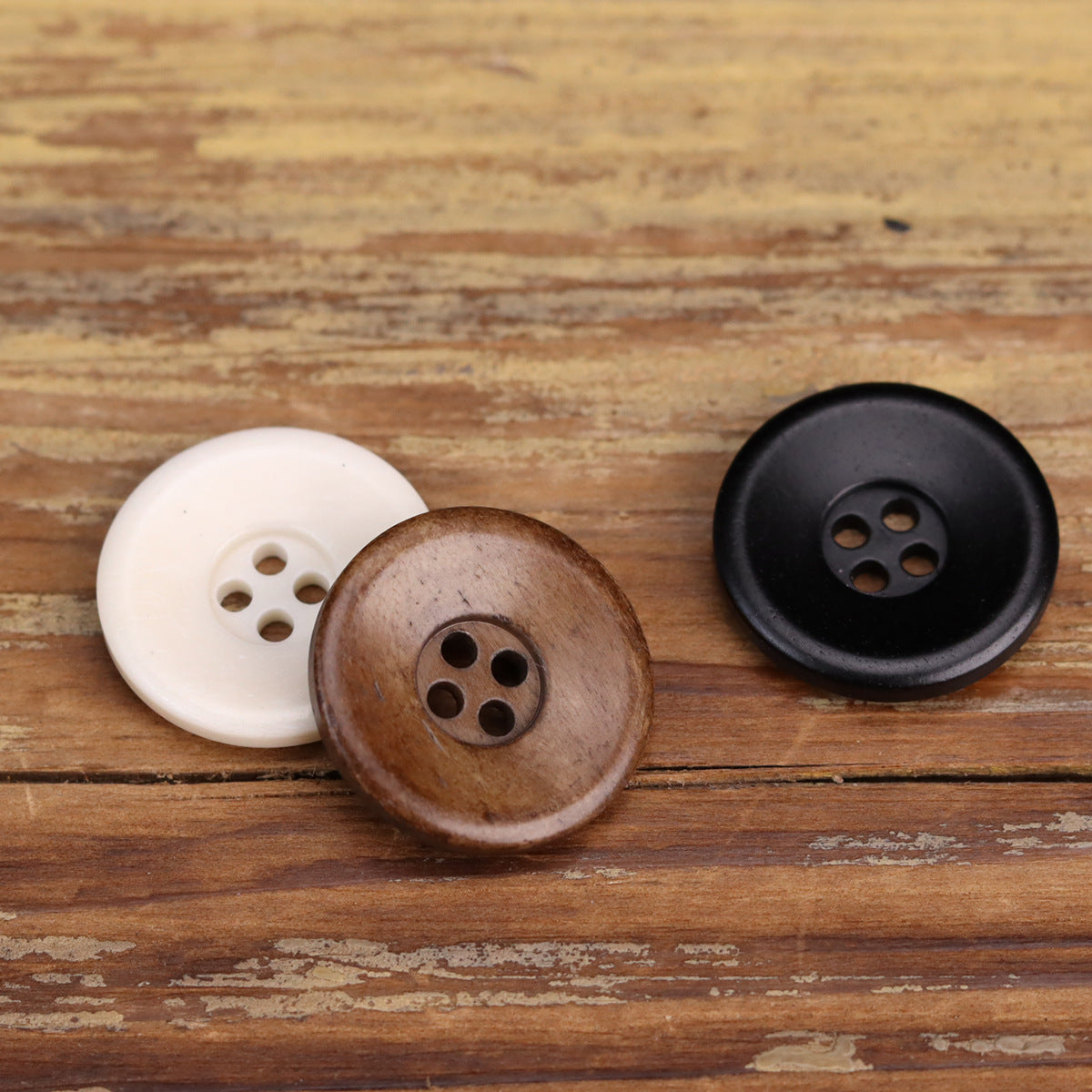 Bowl-shaped 4-hole bone buttons in white, coffee-brown, and black; distressed look