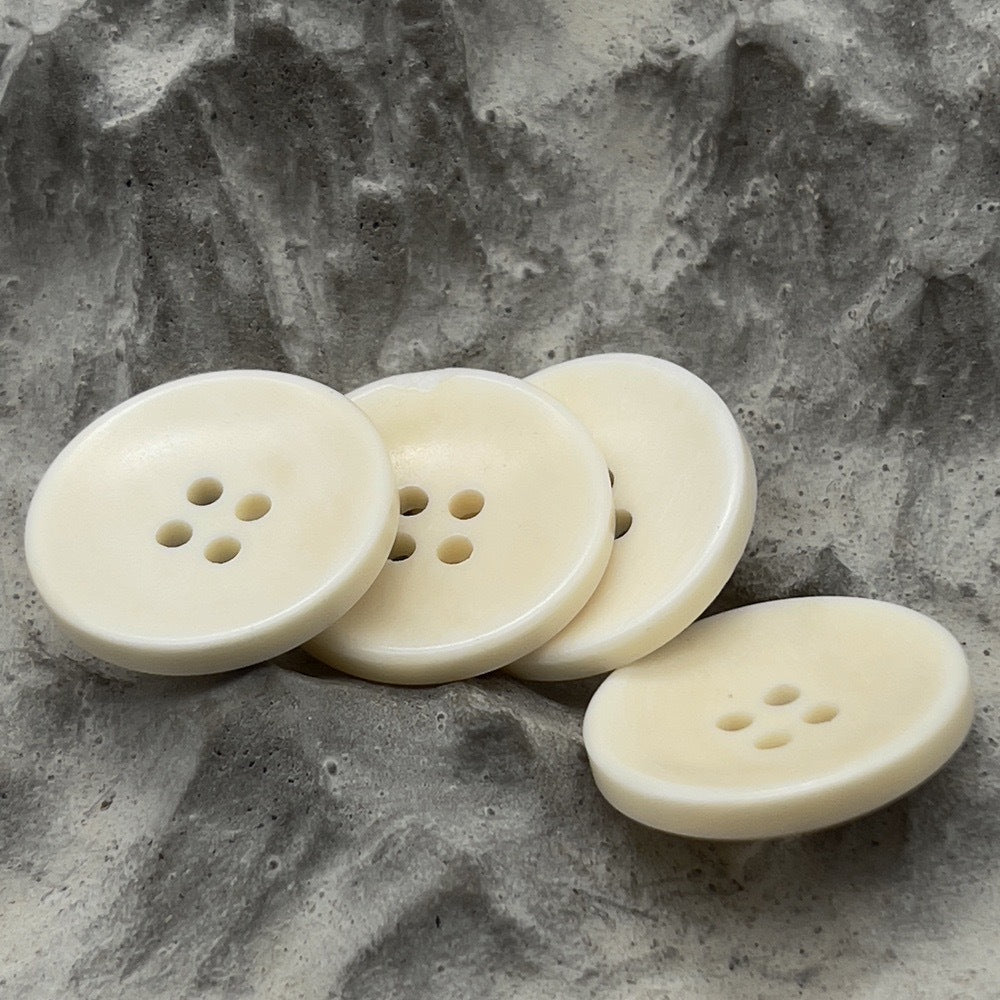 Set of distressed natural bone-look buttons, 4-hole, light cream, round