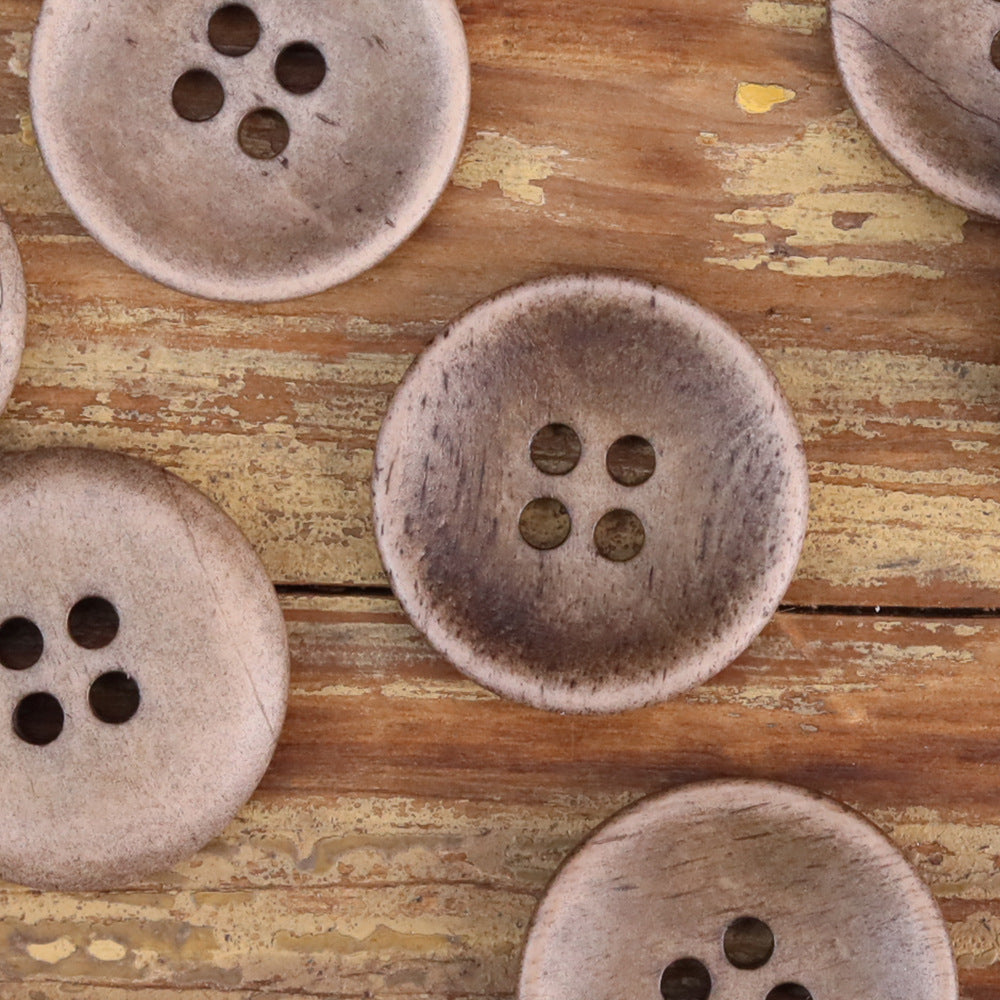 Textured shallow buttons with four holes each, mixed light and coffee-taupe tones