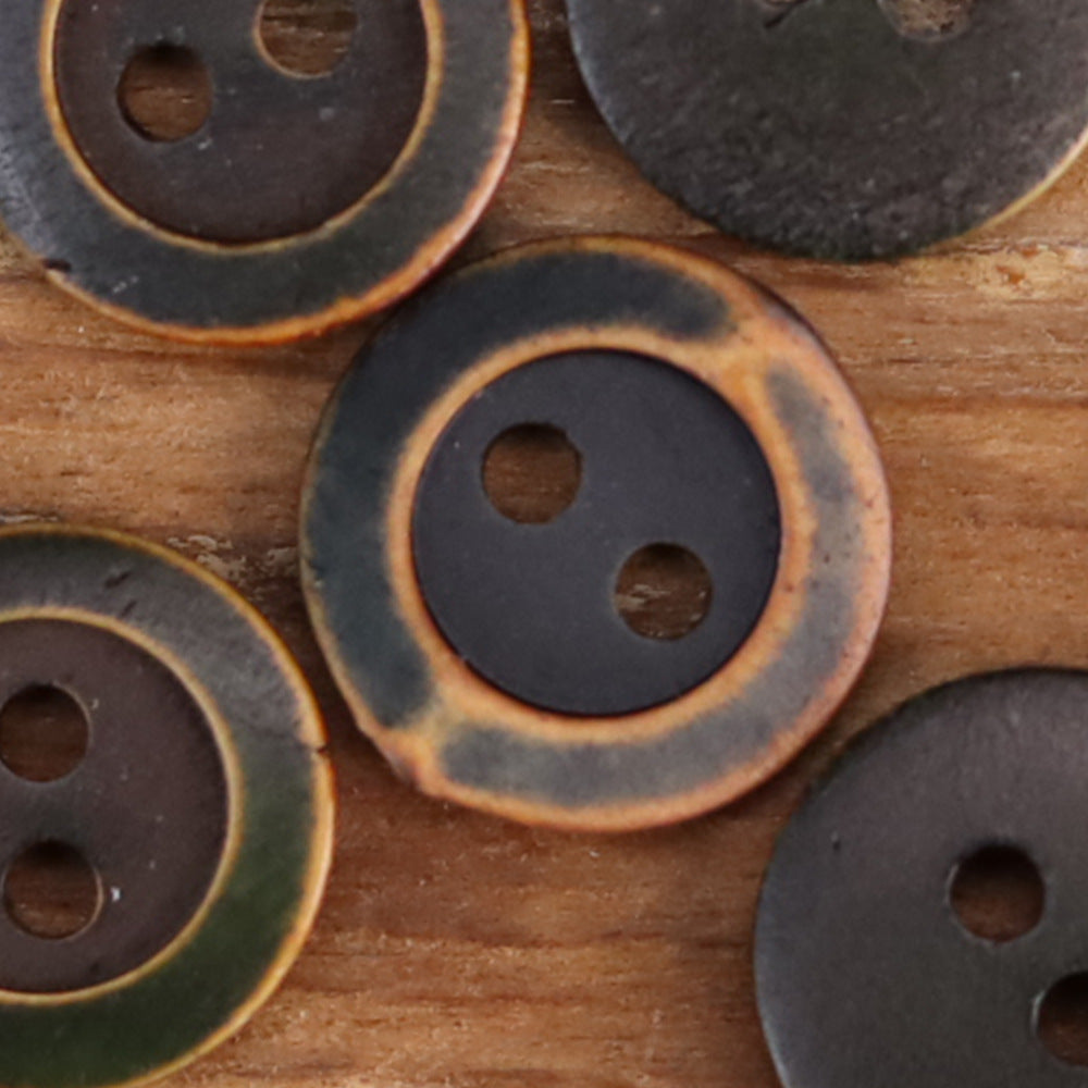 Dark green and black-brown two-hole shirt buttons with tan outer rings