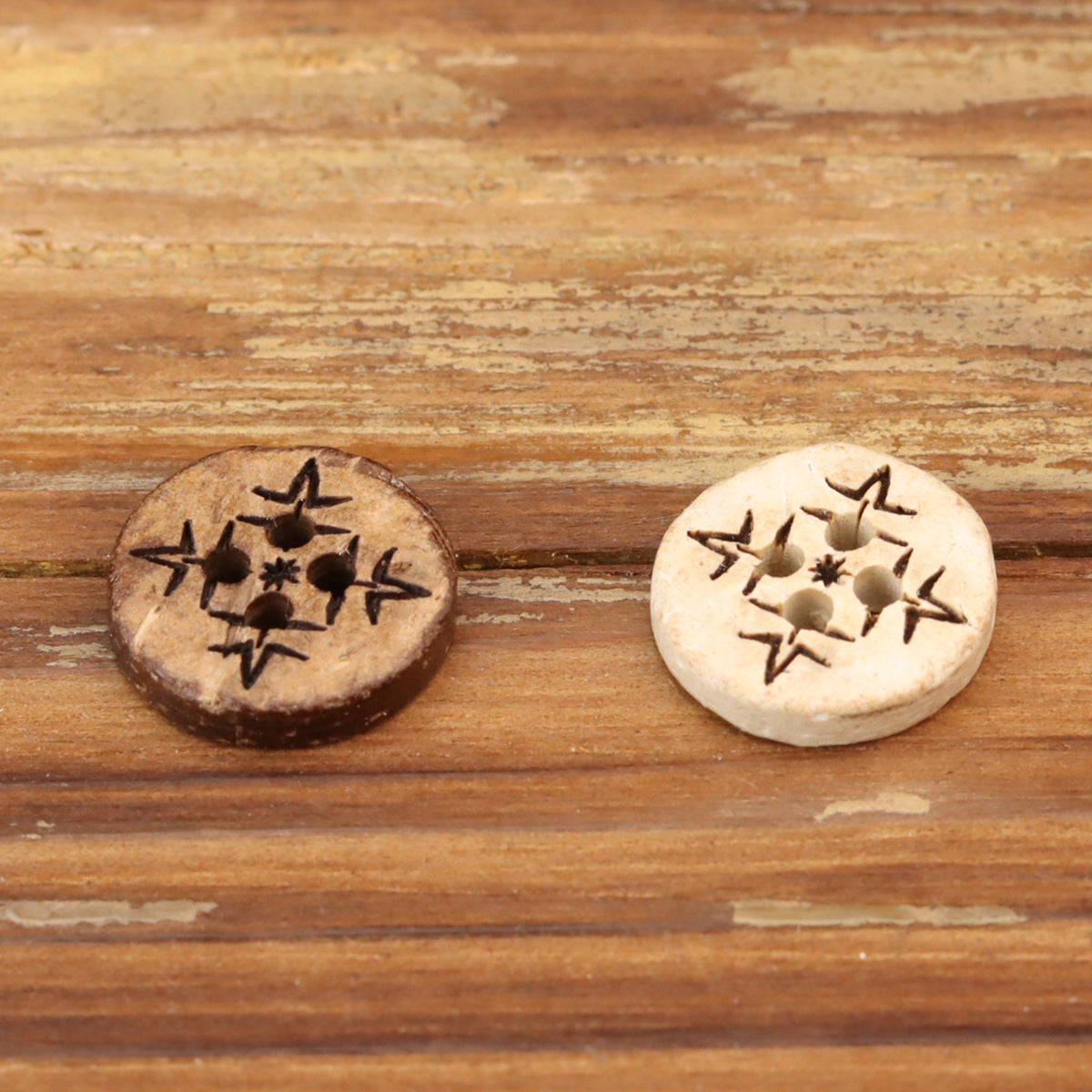 Pair of round wood buttons with plum blossom engraving and four holes