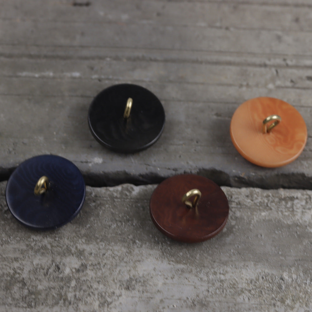 Natural palm nut shank buttons in black, dark blue, dark brown, and orange.