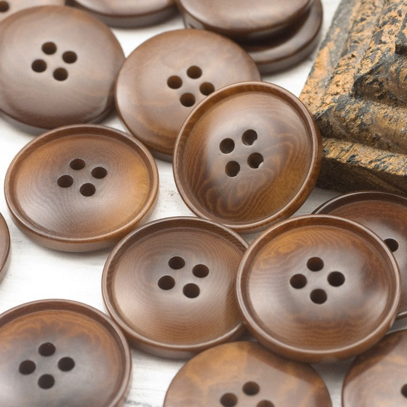 Natural brown and warm beige round four-hole buttons, smooth faces with four holes