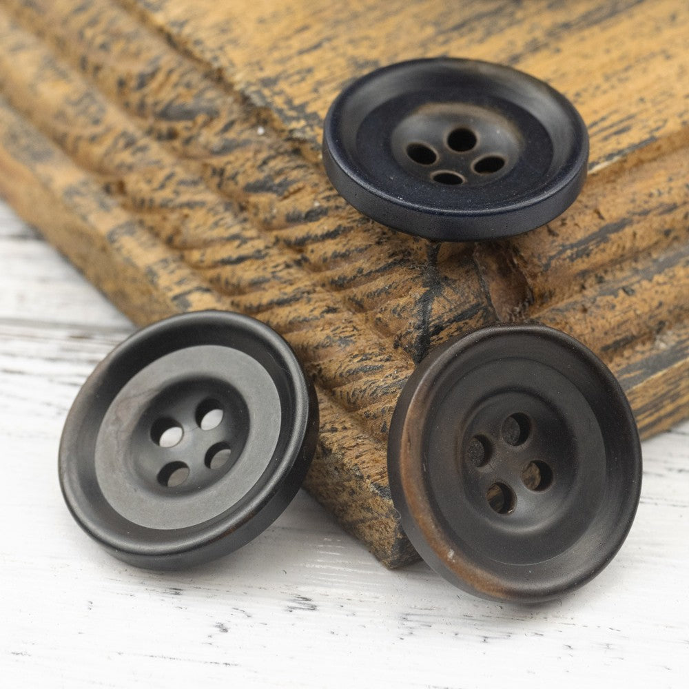 Round dark nut shell buttons, four-hole design, mottled shell finish