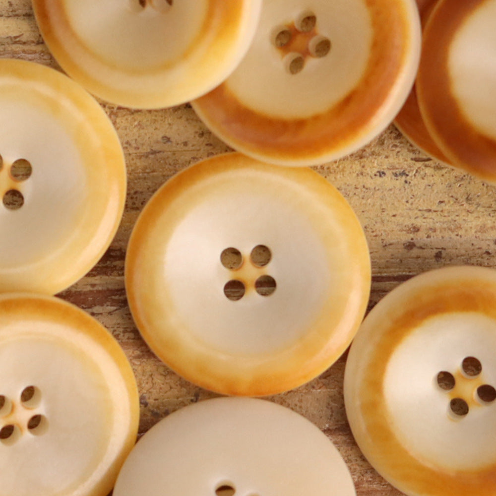 Ivory and honey-yellow nut shell buttons, round 15–25mm, each with 4 holes