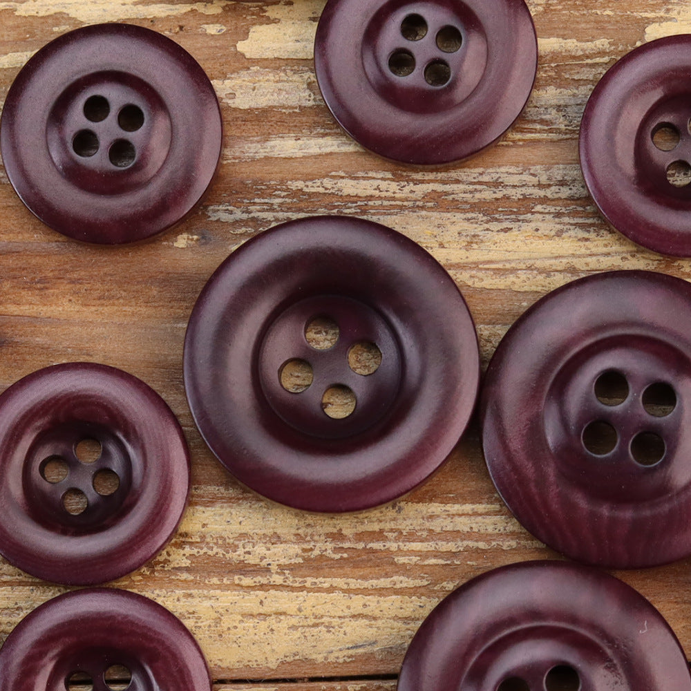 Thickened nut buttons in dark plum tones, four-hole fronts, assorted sizes