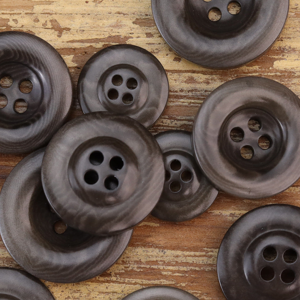 Thickened nut buttons in dark gray/charcoal tones, four-hole fronts