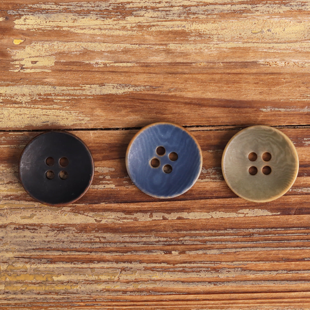 Black, blue, and light green 4-hole natural fruit buttons, 12 pcs.