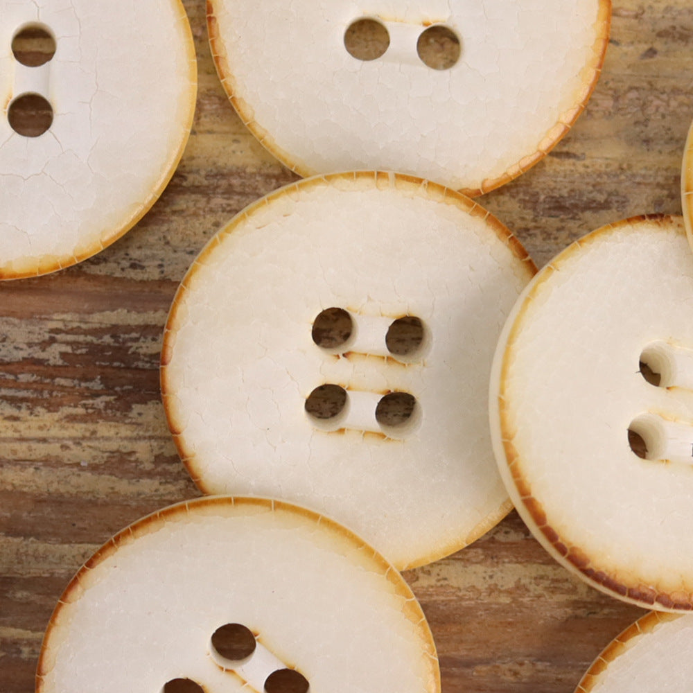 Cracked natural fruit buttons in light cream with 2-hole and 4-hole designs