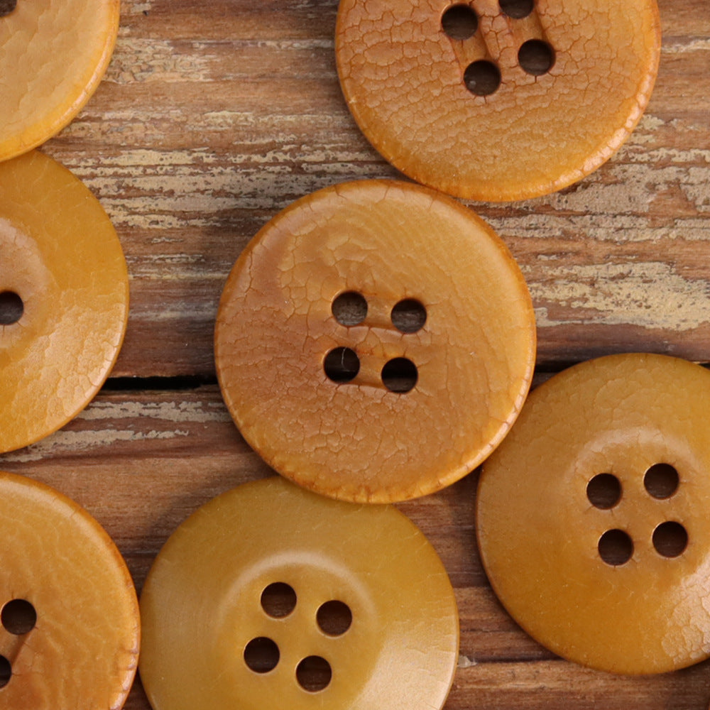 Cracked fruit buttons in orange-brown tones with 4-hole fronts