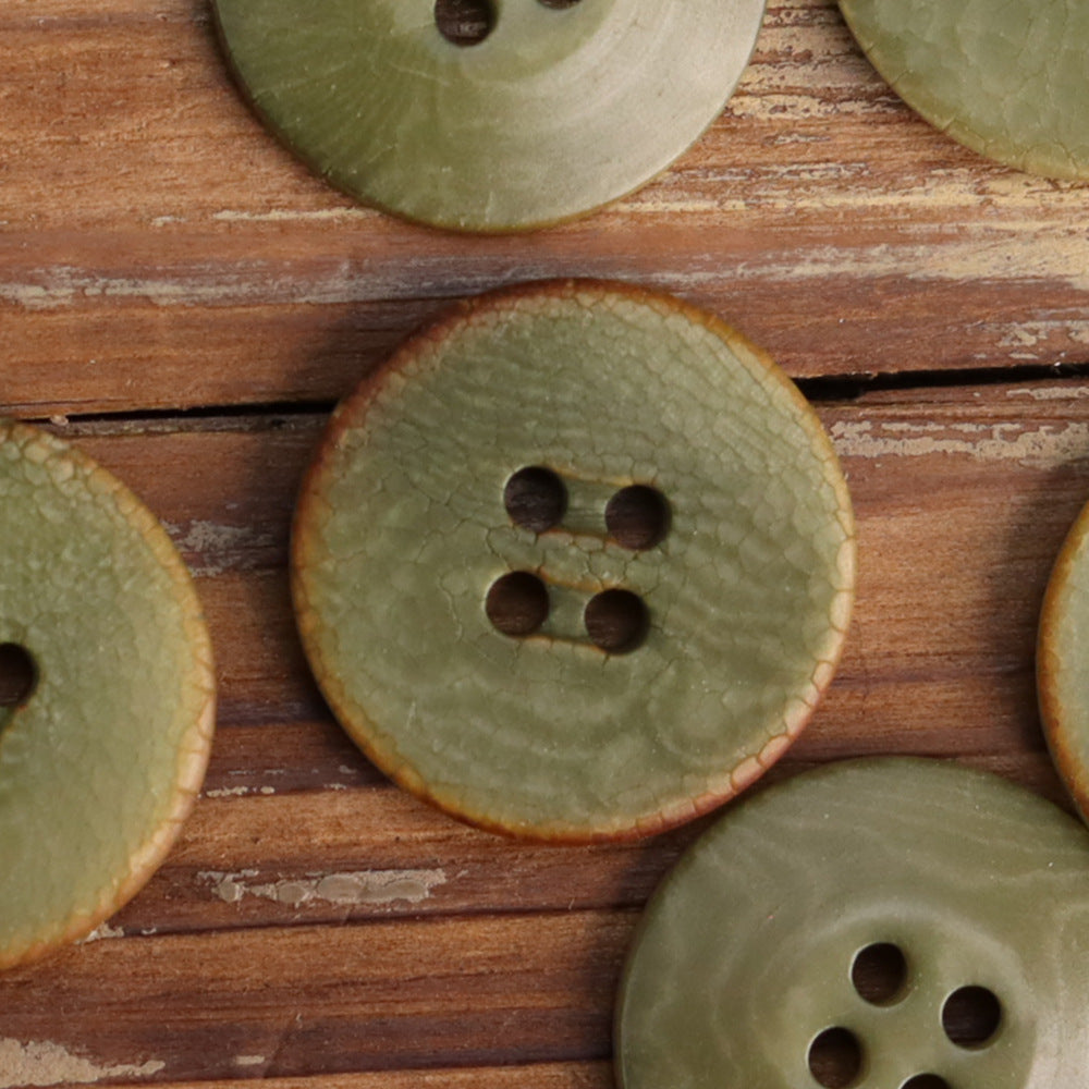 Cracked fruit buttons in olive green with 4-hole button faces