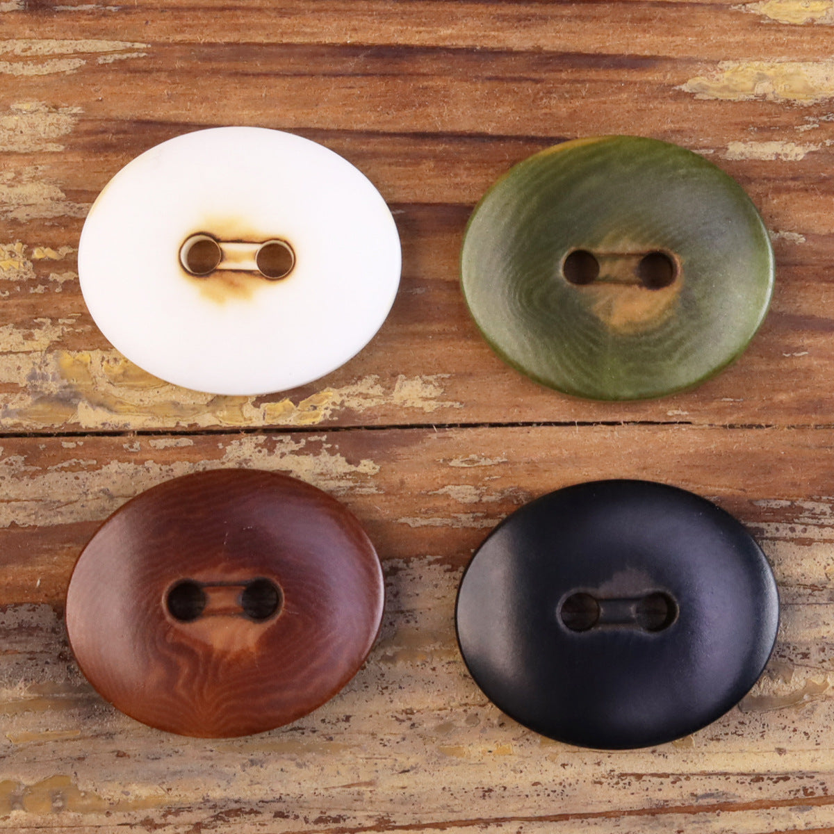 Natural fruit buttons, oval 2-eye in white, olive green, brown, dark navy (4)