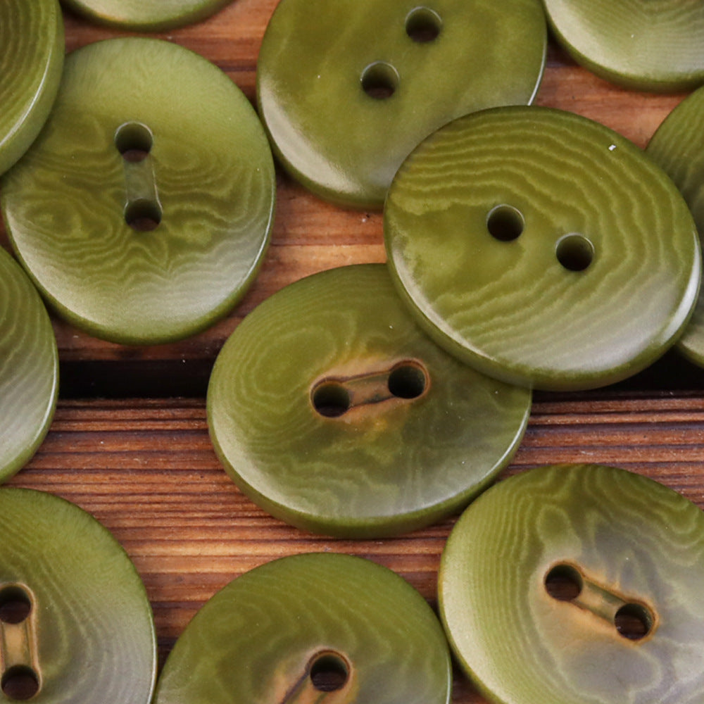 Oval 2-eye natural fruit buttons, olive green woodgrain (close-up, several)