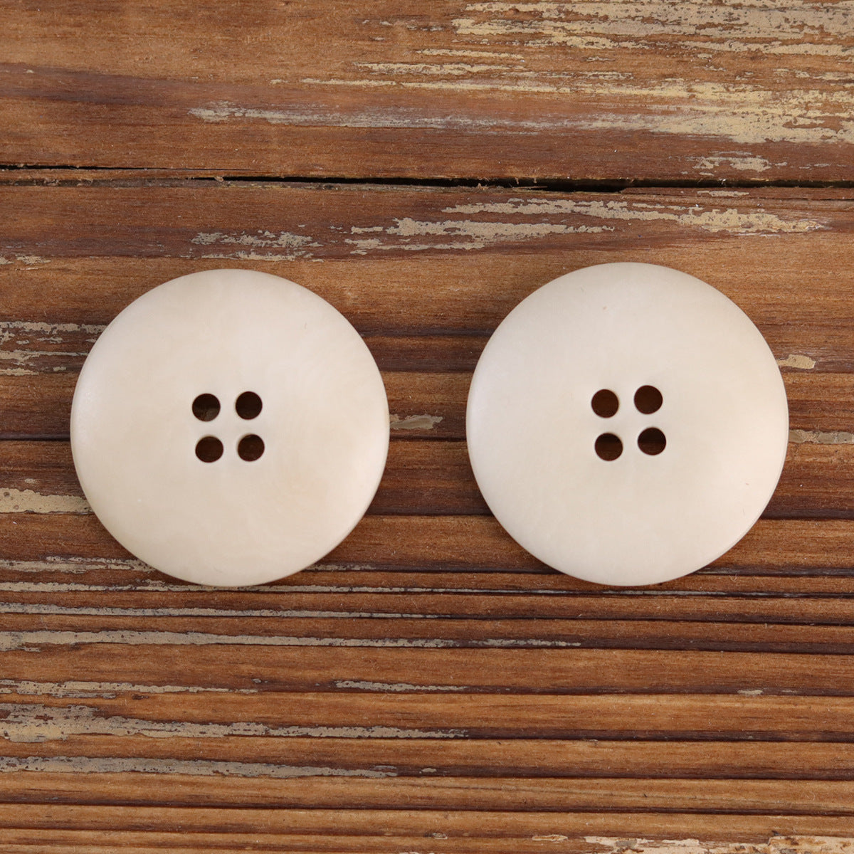 Burned white corozo buttons, pair of round 4-hole styles
