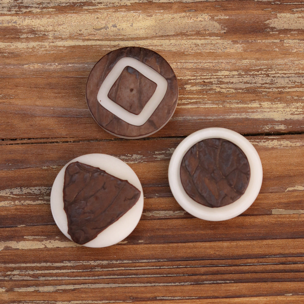 Corozo buttons set: square, triangle, and round shapes with white rings