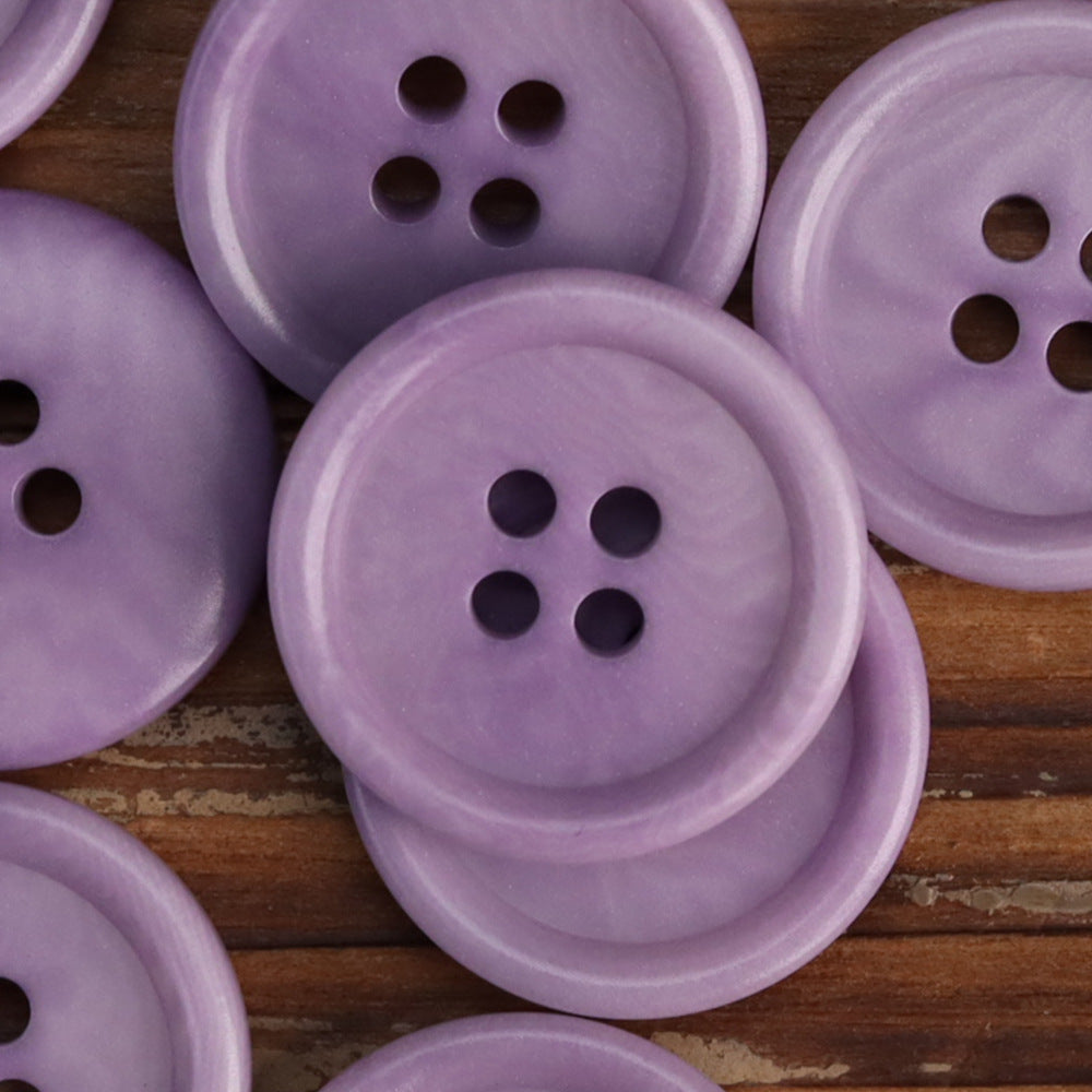 Lilac purple 4-hole corozo buttons, stacked close-up with round faces