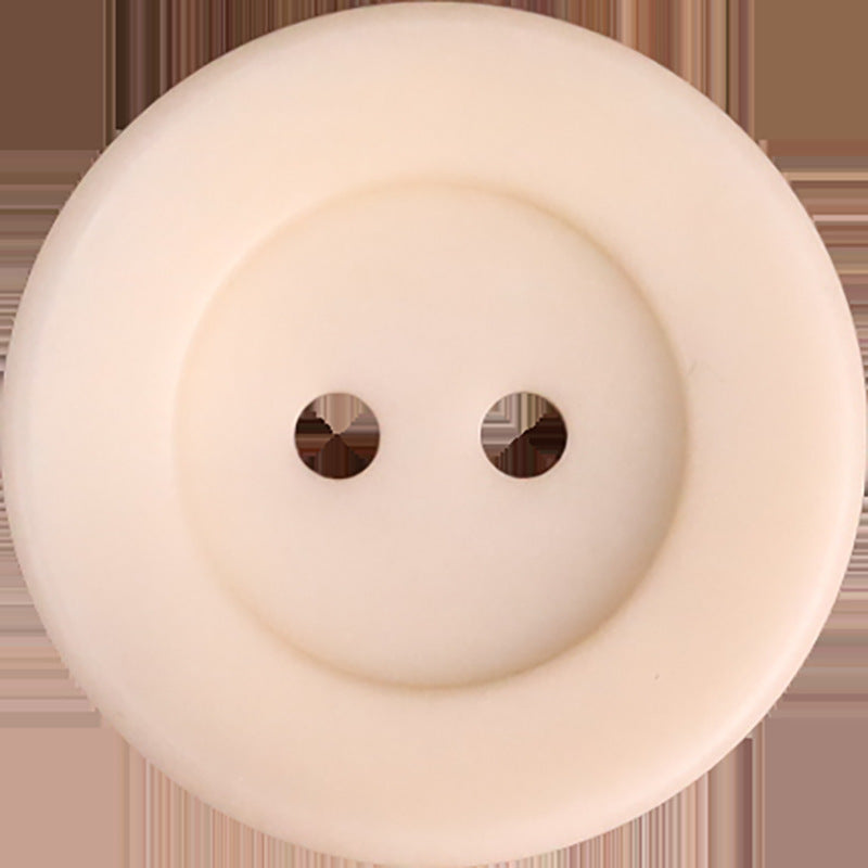 Cream two-hole corozo button, bowl-shaped front with two holes