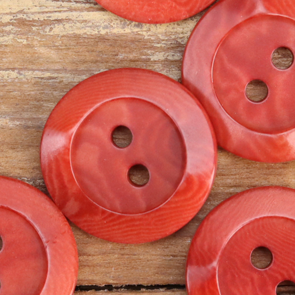 Red irregular corozo 2-hole buttons with textured surface