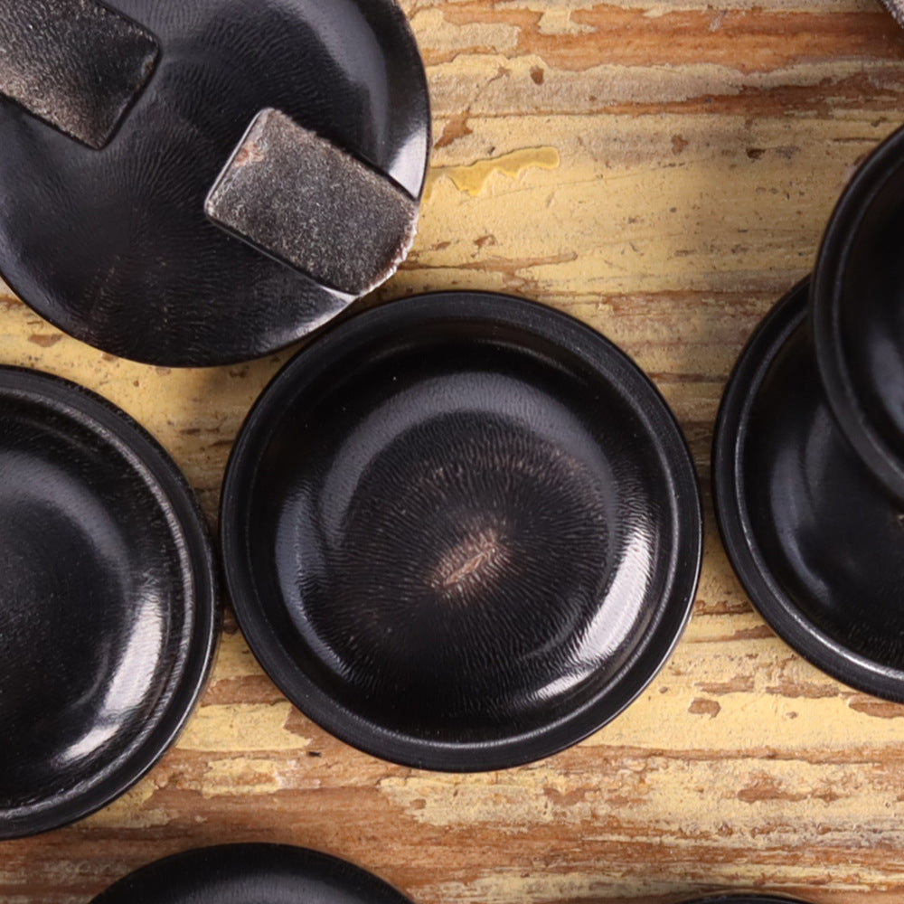 Black genuine horn blind coat buttons, textured front faces with shank slots