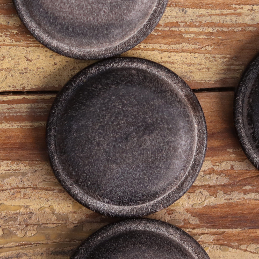Dark gray genuine horn blind coat button faces with subtle grain texture