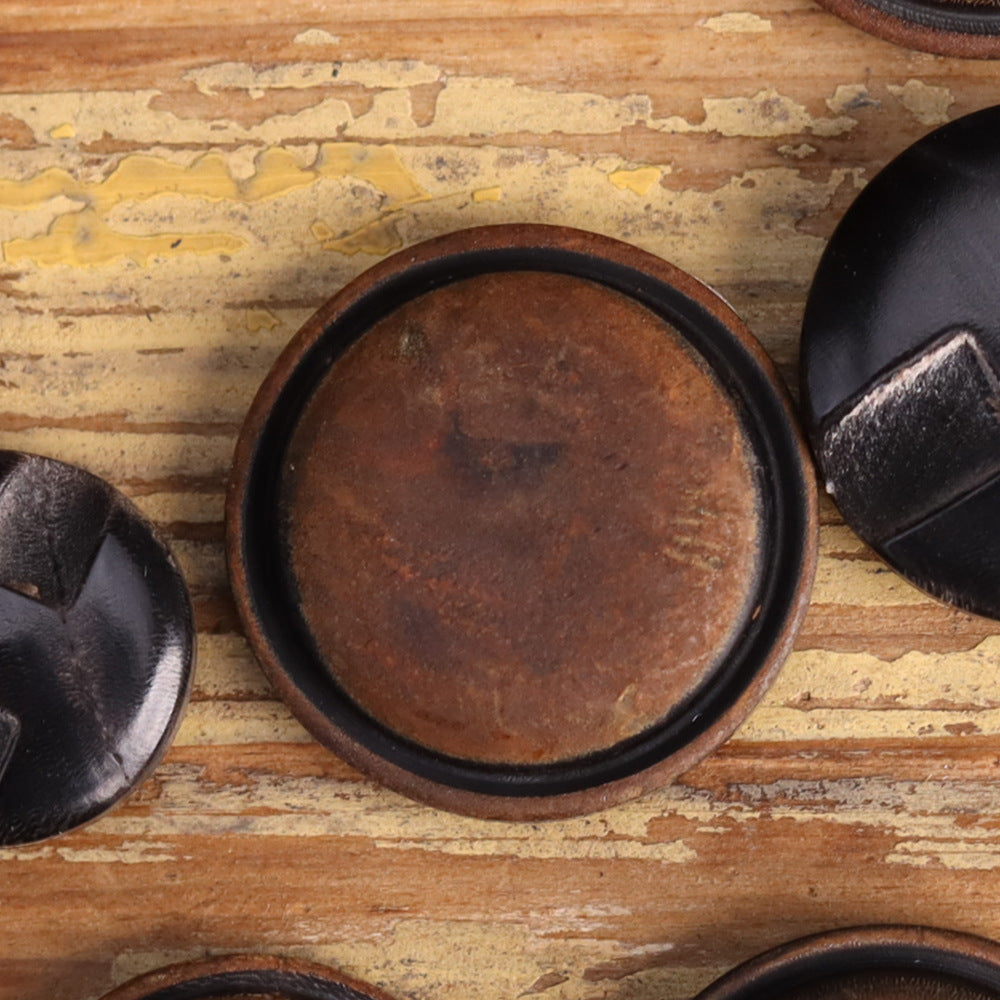 Coffee-brown genuine horn blind coat button face with dark rim, shank slot visible