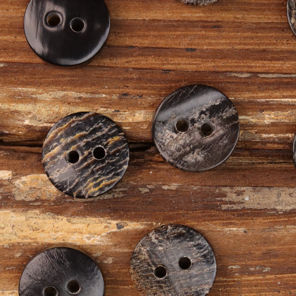 Set of natural horn-look two-hole buttons, dark tones, rough texture with two holes