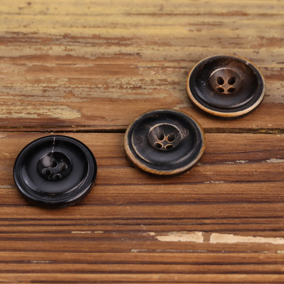Mixed black and dark coffee horn buttons with four-hole faces