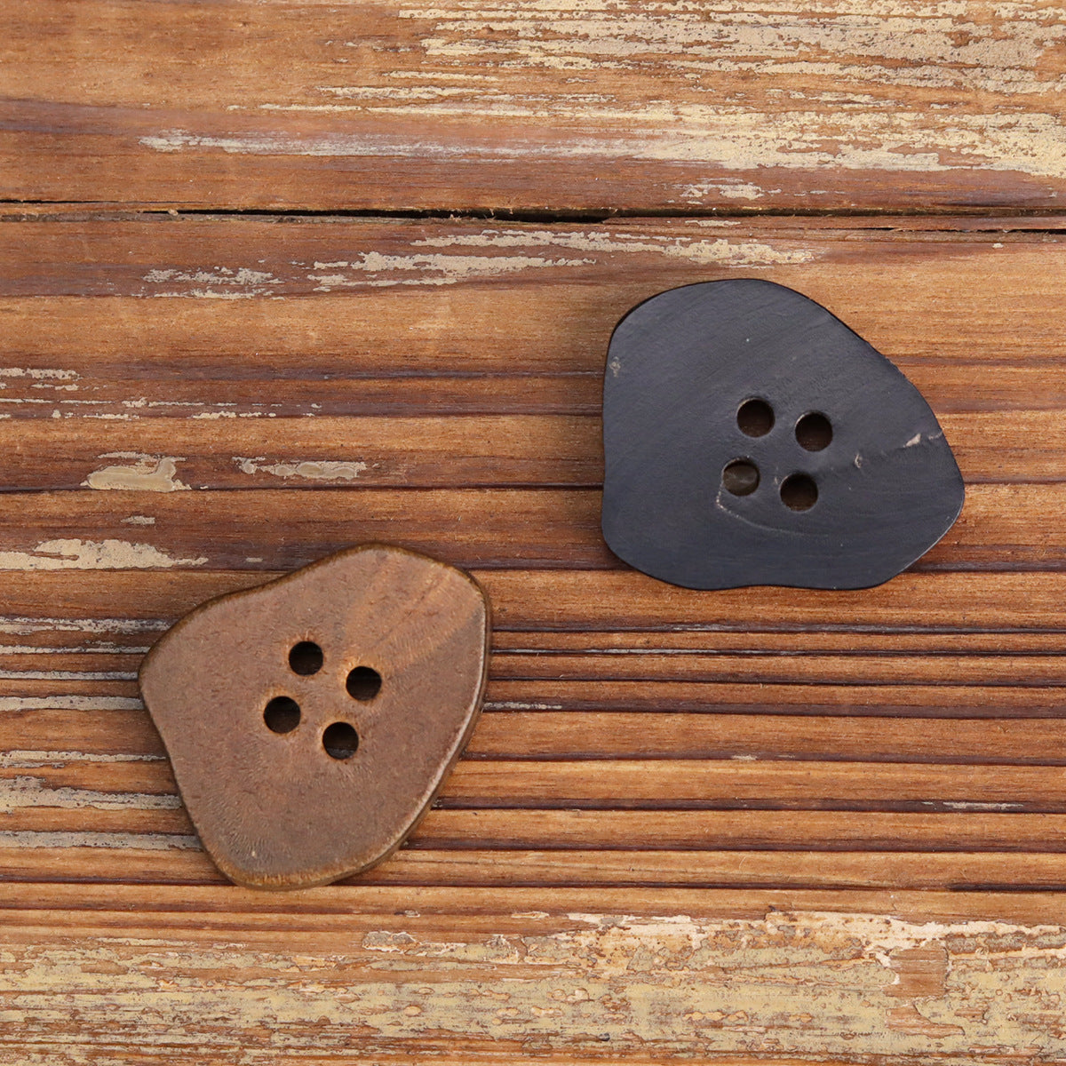 Burnt coffee and burnt black irregular horn buttons with 4 holes