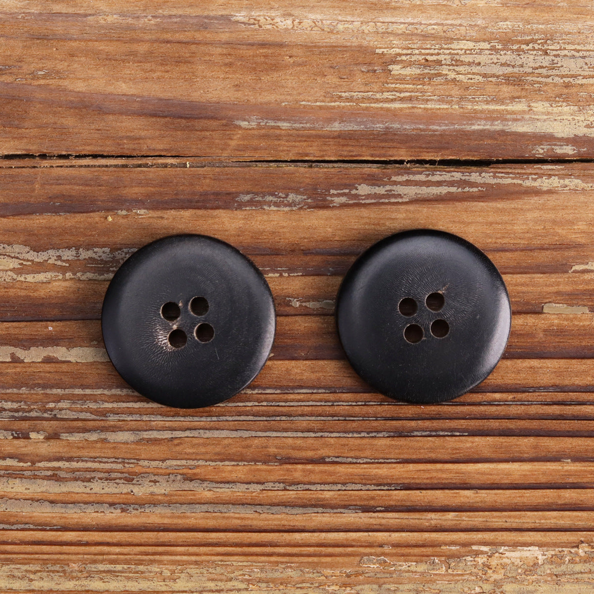 Horn-look sewing button, four-hole, Style B dark matte finish.