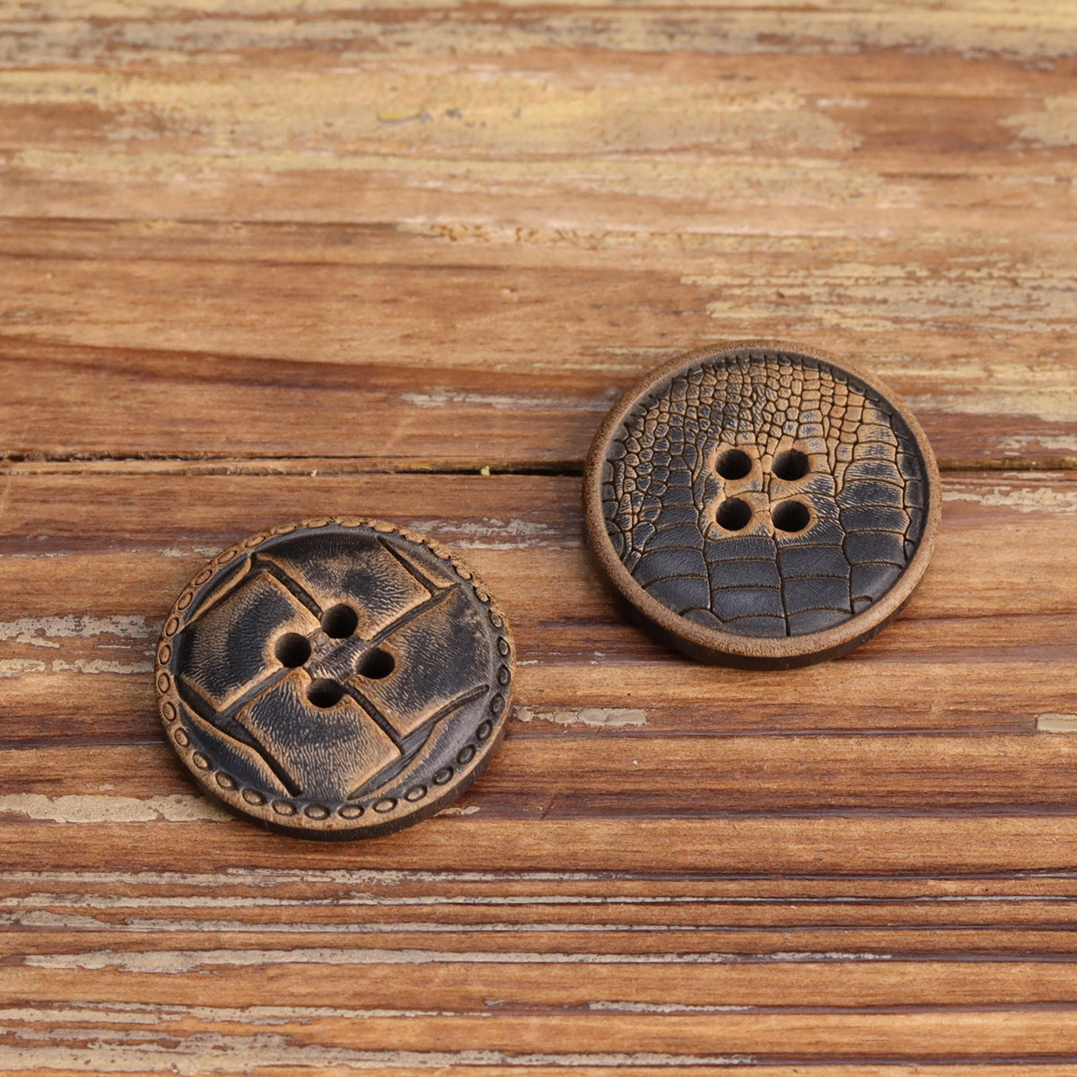 Four-hole sewing buttons, Style B embossed leather texture, pair.