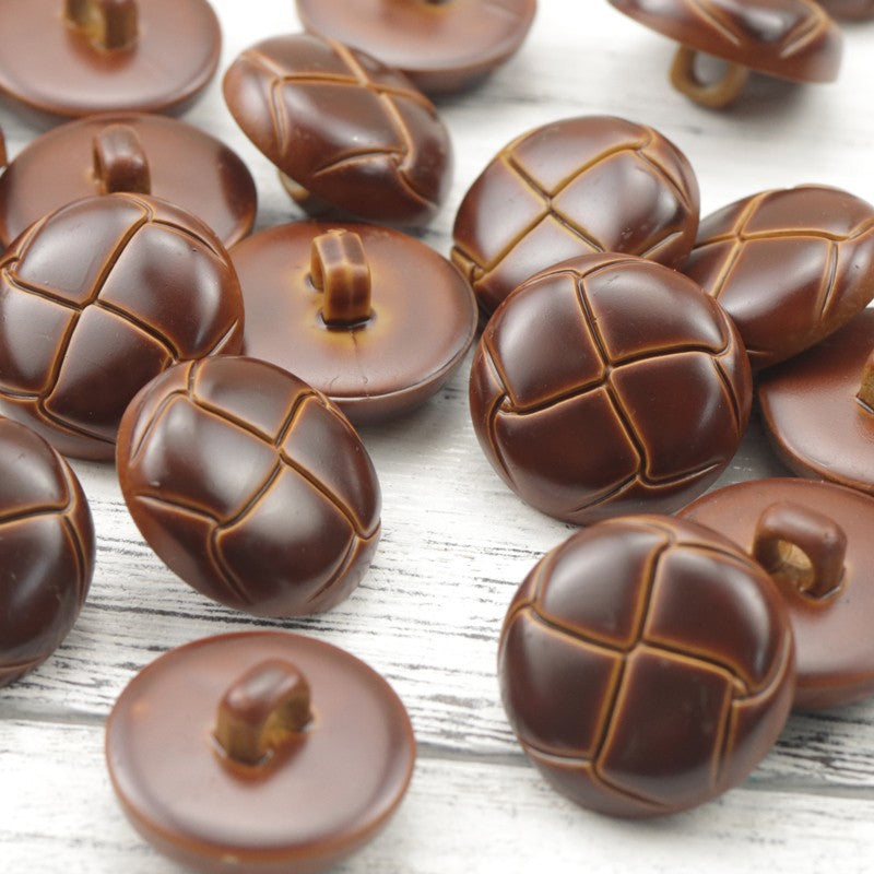 Reddish-brown plastic woven ball buttons, circular tops with stitched grid and center shank