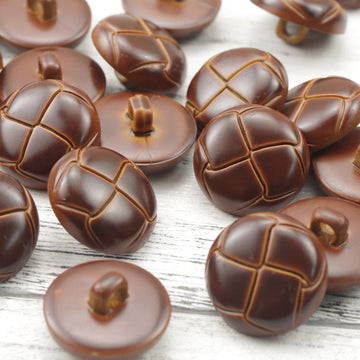 Reddish-brown plastic woven ball buttons, circular tops with stitched grid and center shank