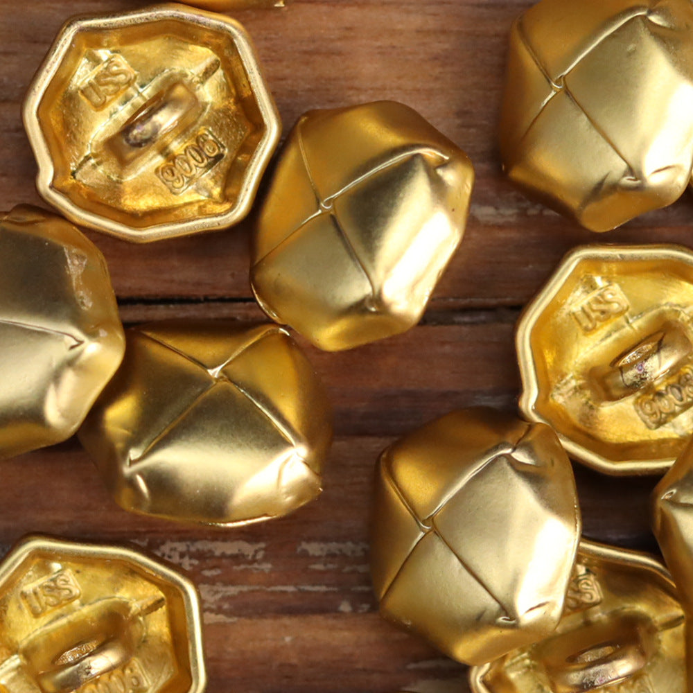 Gold-tone metal button backs and fronts with embossed markings; distressed octagonal shape