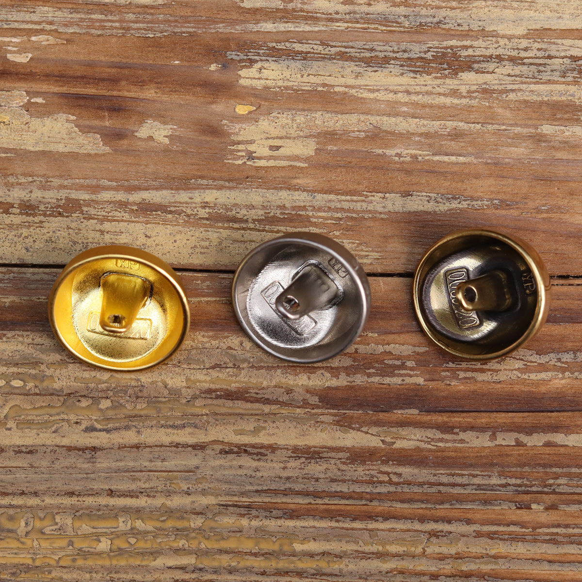 Vintage metal buttons with shanks: gold, silver, and antique gold, back sides