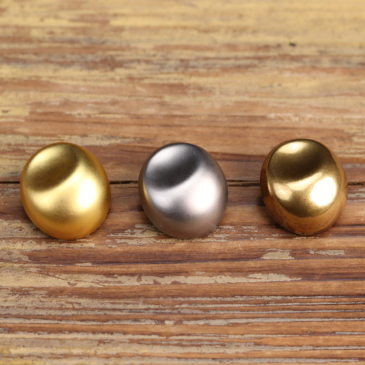 Round vintage metal buttons shown in gold, silver, and antique gold finishes (3)
