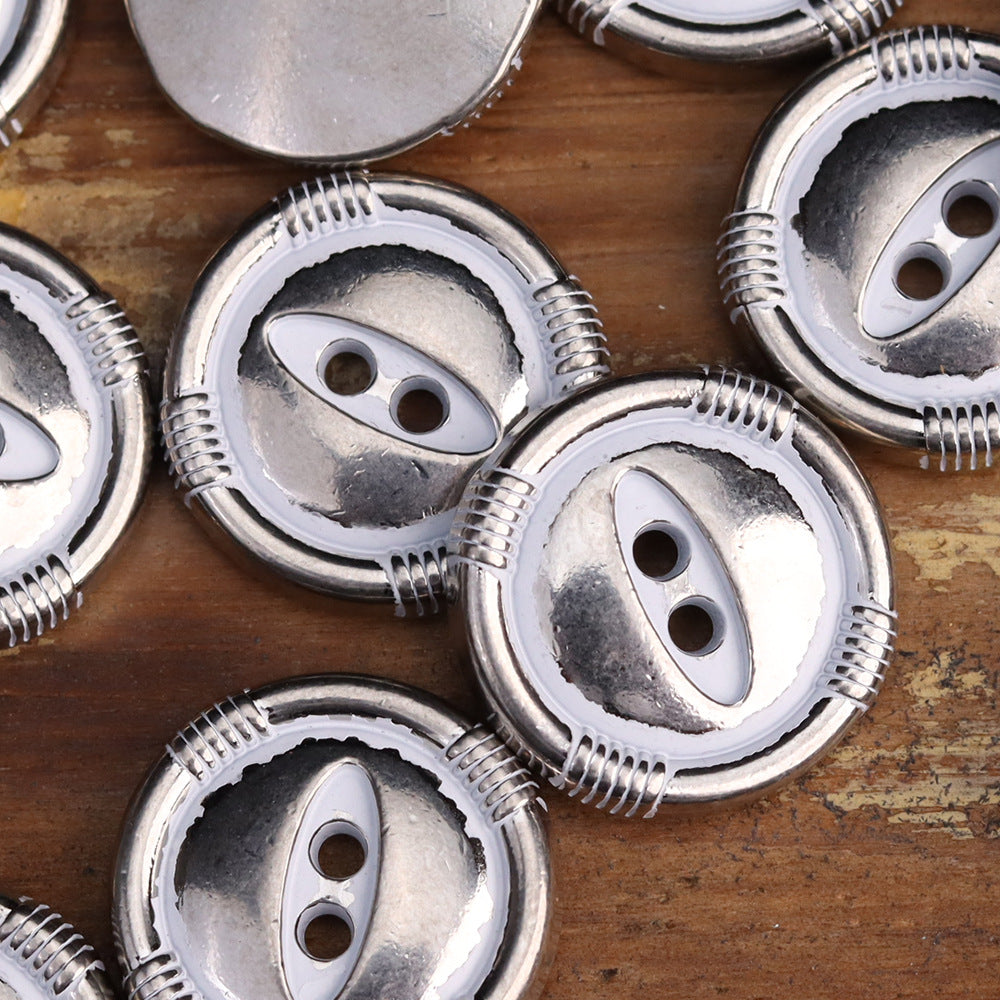 Silver fish-eye metal buttons, two-hole face and ridged outer band on round base