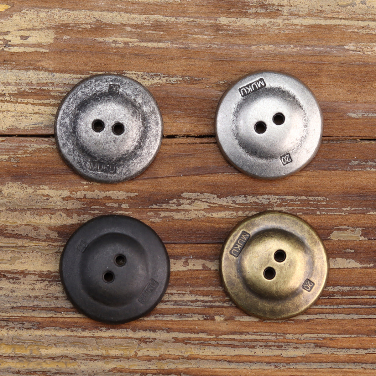 Two-hole jacket buttons in white silver and black silver, with bronze-colored pair