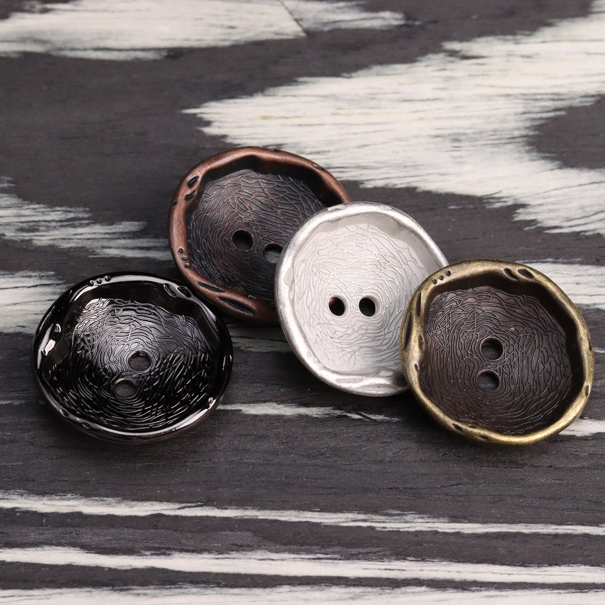 Antique 2-hole metal buttons: black, red bronze, silver and bronze, close group