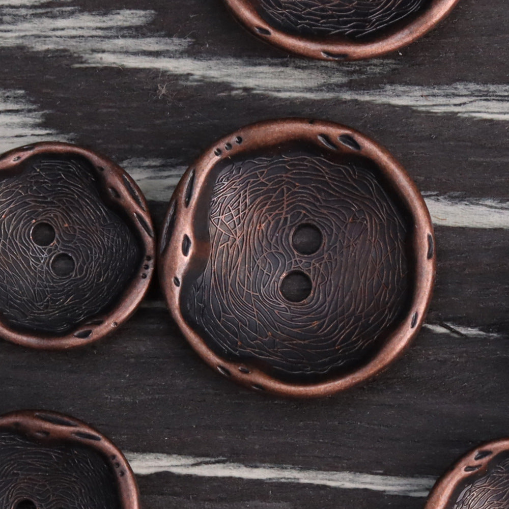 Antique red bronze 2-hole metal button with embossed swirl pattern