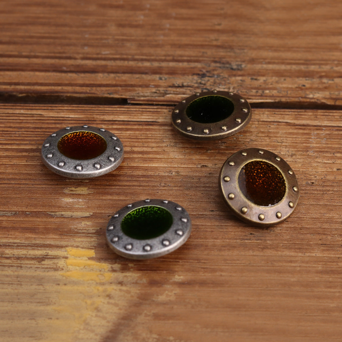 Metal sew-on button set with dark green and brown glitter centers, bronze-tone stud rims