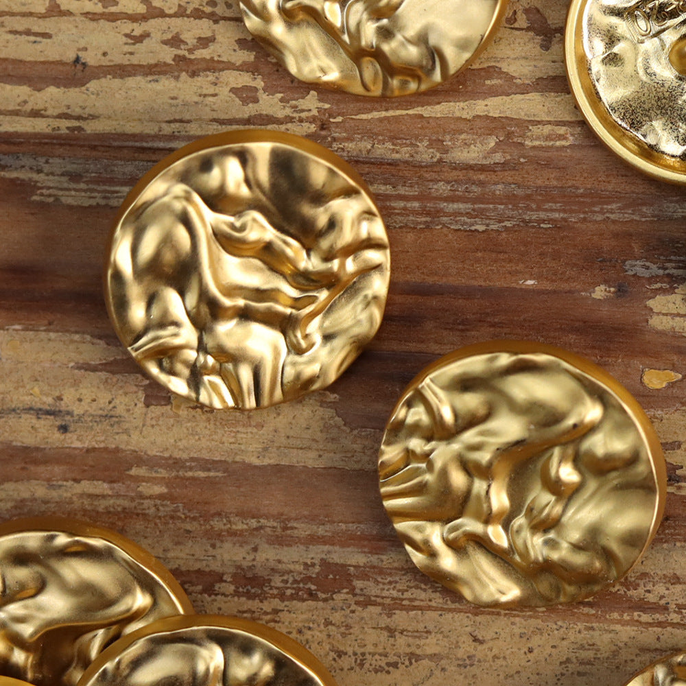 Round wavy metal buttons, gold matte finish with embossed swirl texture