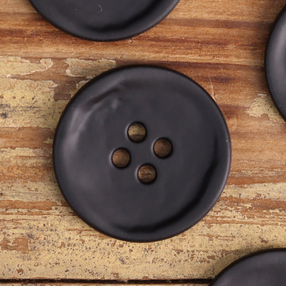 Black 4-hole metal jacket button, smooth round face with four holes