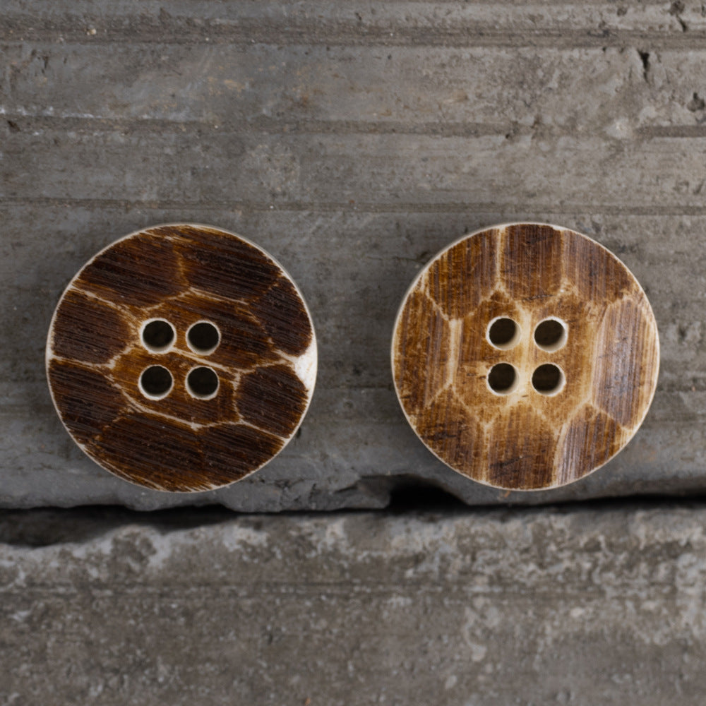 Pair of round 4-hole buttons in dark brown with wood-grain pattern