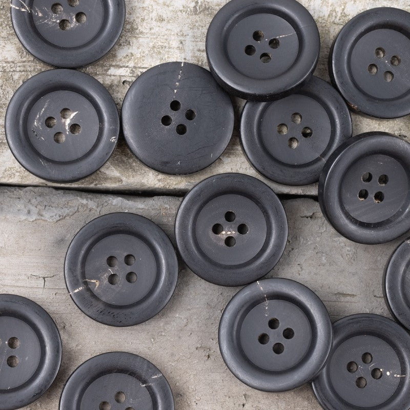 Dark horn-style buttons with thick wide brim, multiple 4-hole designs