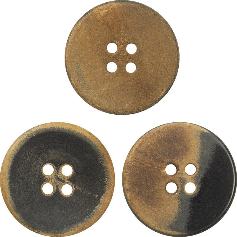 Flat retro horn button, black with yellow-brown burnt edges, four-hole front view