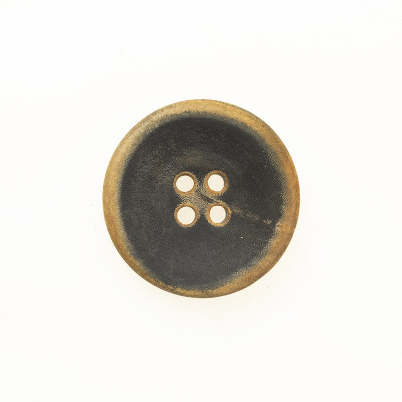 Black flat retro horn button with yellowish-brown half-burnt finish, four holes